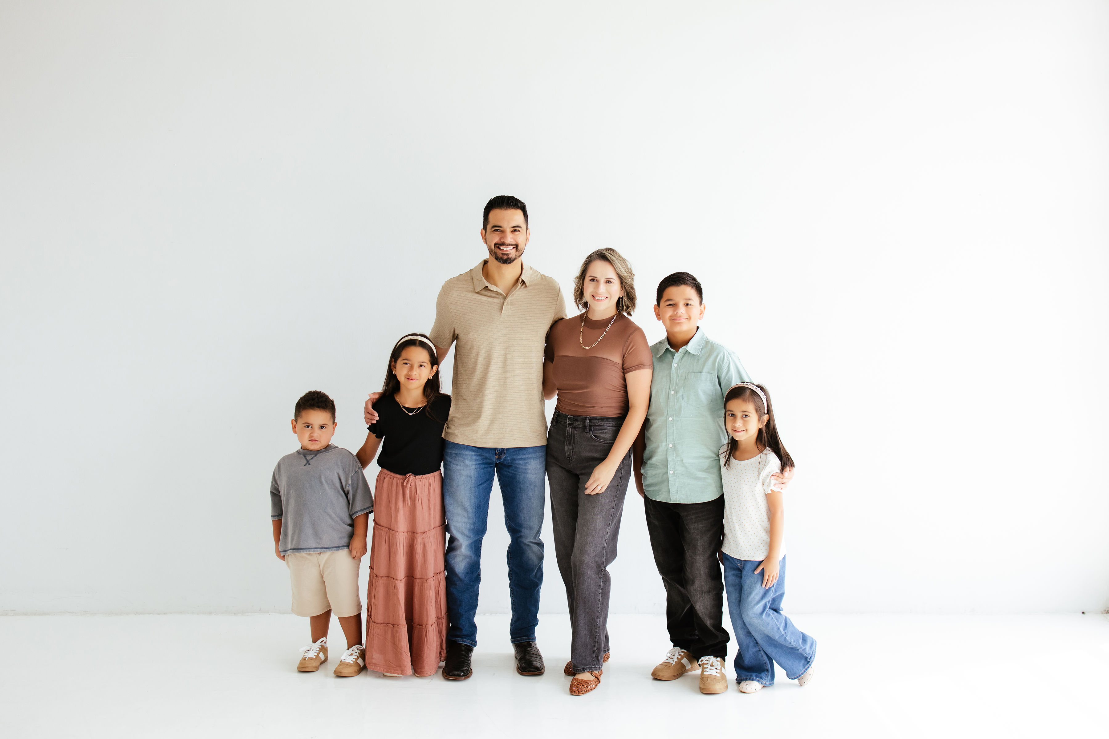 Joe and Bianca Gallegos with their four children in their current family portrait